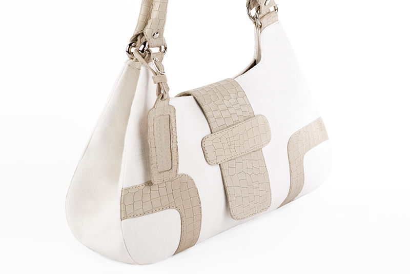 Handcrafted women's luxurious elegant handbag in premium off white and champagne white leather. Perfect for elevated everyday style.   
                Choose from our luxurious collections of leather and fabric to perfectly match your handbags to your outfits.